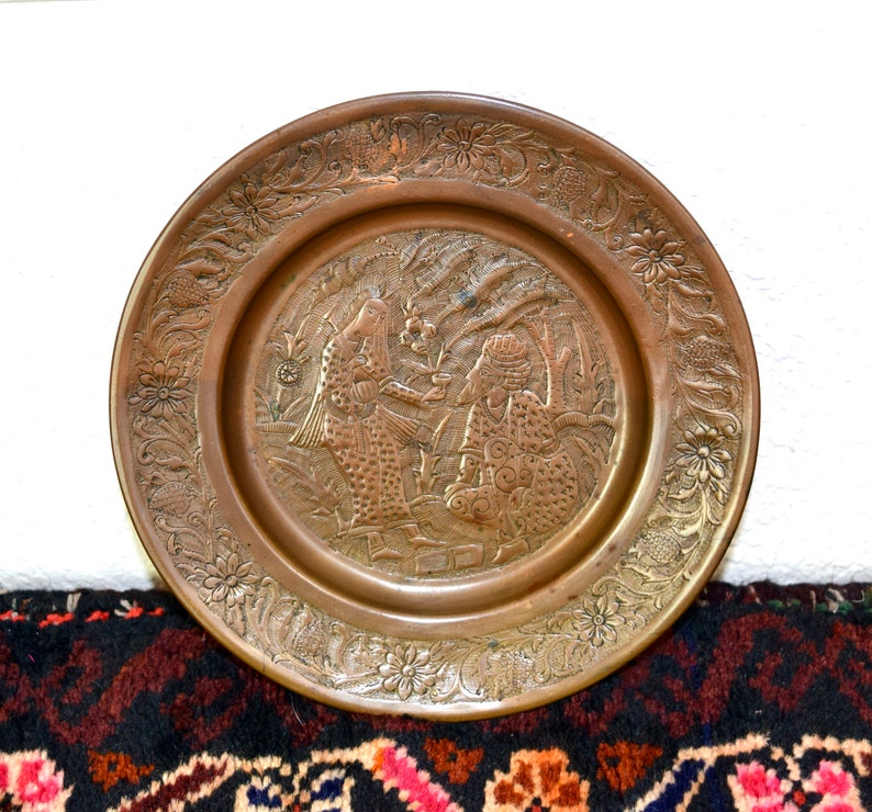 Vintage etched copper plate or tray...engraved with woman serving man wine...ghalamzani...، نمای 2
