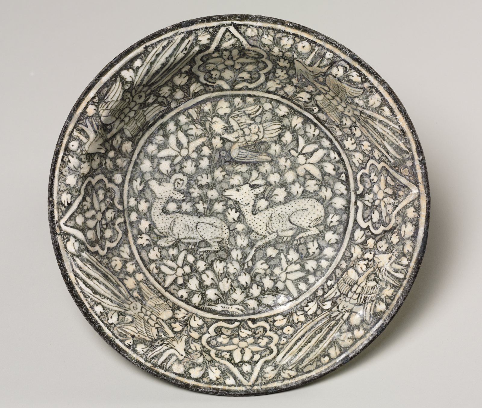 Ceramic dish with deer, phoenix, and lotus blossoms, 1924.742; Iran, 1300–1350
